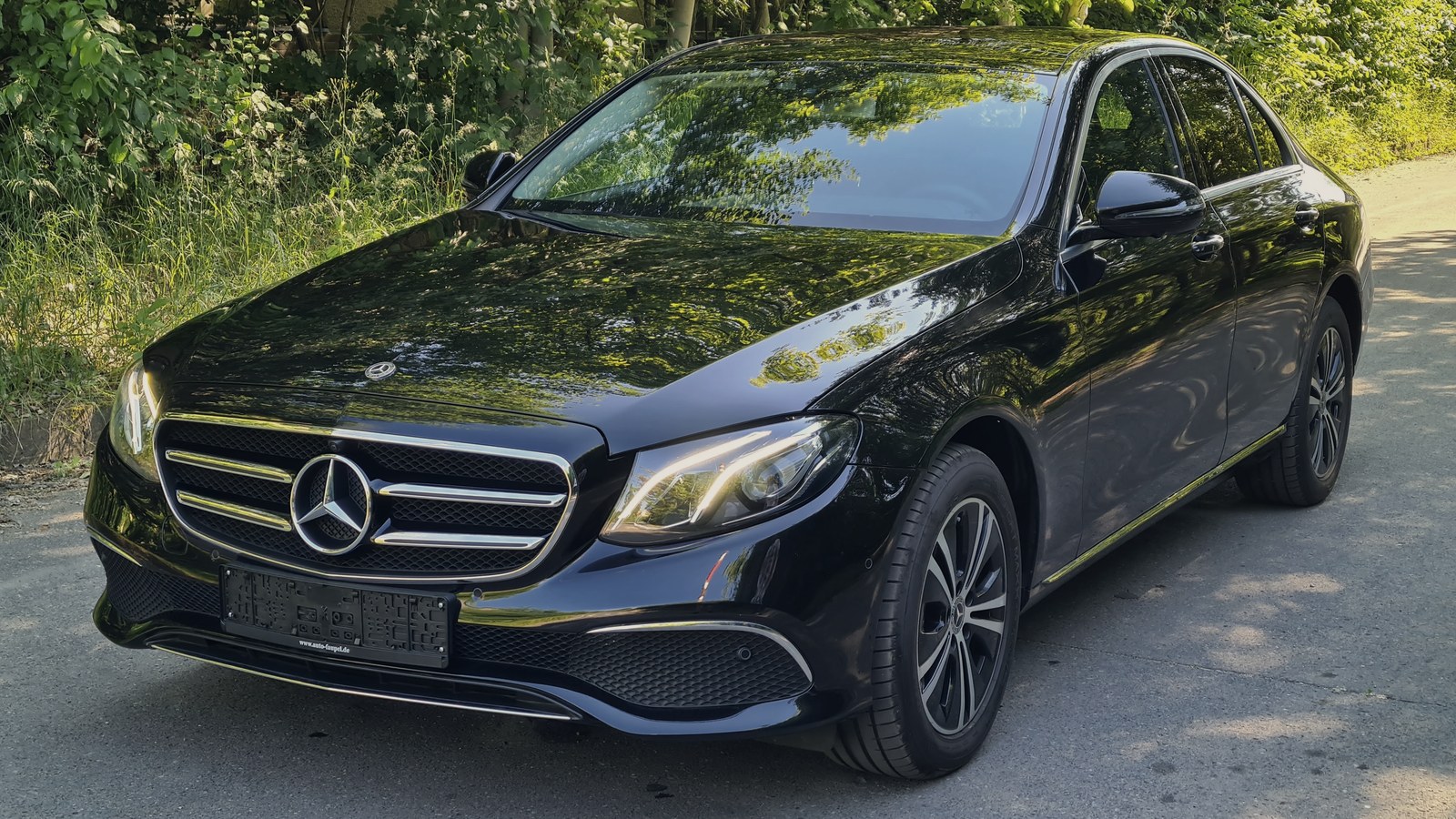 A chauffeur-driven executive saloon, operated by a local partner